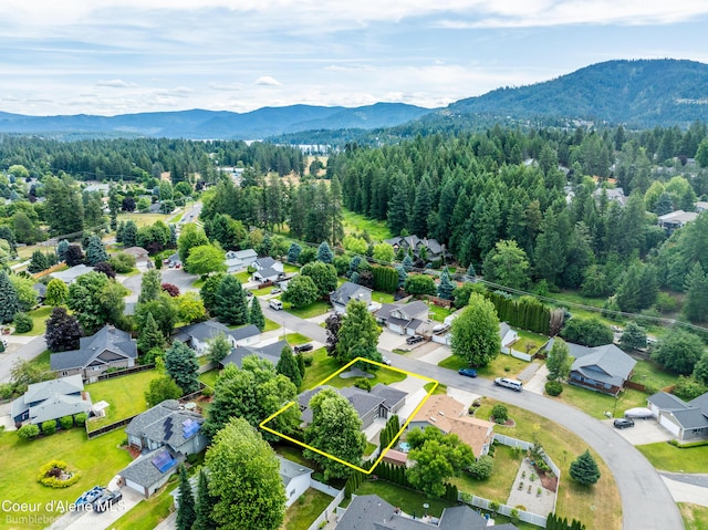 870 E Cloverleaf Dr, Hayden, ID 83835 - aerial view of residential area featuring a mountainous background and property boundaries highlighted