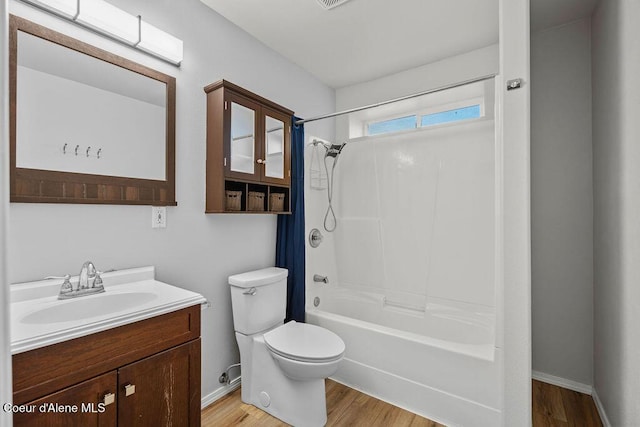 5735 E Steamboat Bnd, Post Falls, ID 83854 - full bath with vanity, washtub / shower combination, and wood finished floors