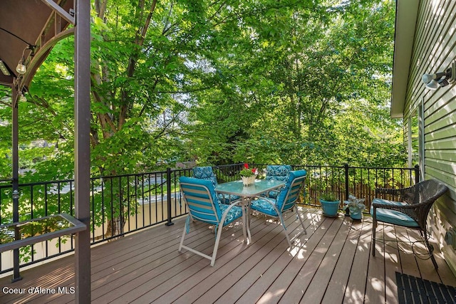 5735 E Steamboat Bnd, Post Falls, ID 83854 - wooden deck with outdoor dining area