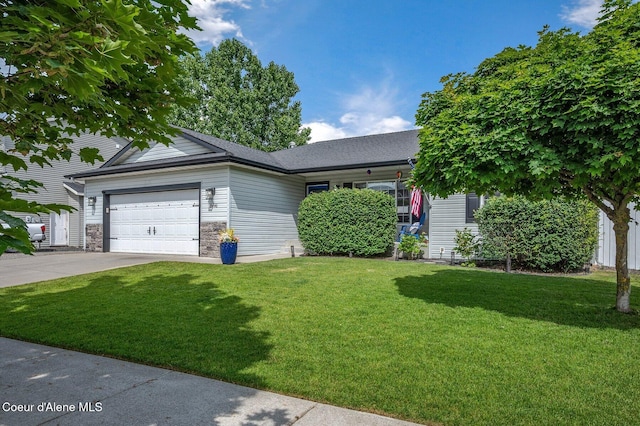 8446 N Boysenberry Loop, Hayden, ID 83835 - view of front of home with a front yard, driveway, an attached garage, and a shingled roof
