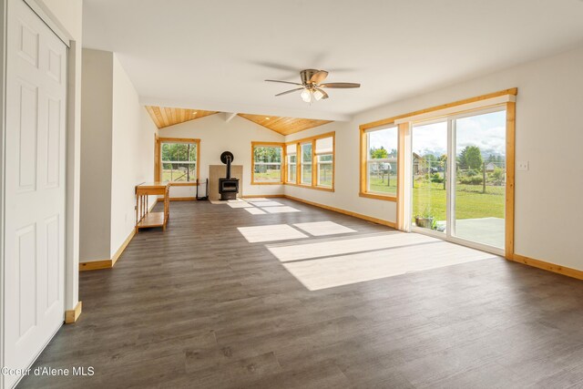 185 Leo Ln, Moyie Springs, ID 83845 - unfurnished living room with a wood stove, ceiling fan, and dark wood-style floors
