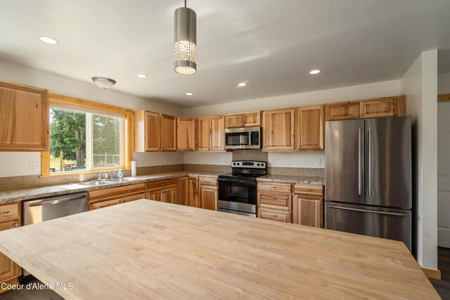 185 Leo Ln, Moyie Springs, ID 83845 - kitchen featuring stainless steel appliances, wooden counters, recessed lighting, and pendant lighting