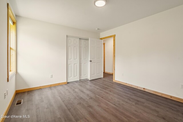 185 Leo Ln, Moyie Springs, ID 83845 - unfurnished bedroom with wood finished floors and a closet