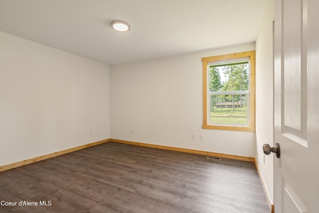 185 Leo Ln, Moyie Springs, ID 83845 - spare room featuring dark wood-style floors and baseboards