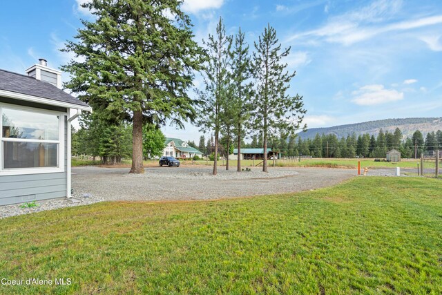 185 Leo Ln, Moyie Springs, ID 83845 - view of green lawn with a mountain view