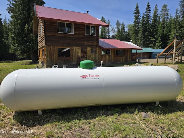 475 Old Range Rd, Clark Fork, ID 83811 - exterior view of propane tank and a metal roof