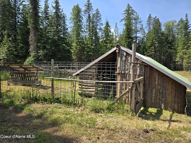 475 Old Range Rd, Clark Fork, ID 83811 - view of outdoor structure featuring a wooded view