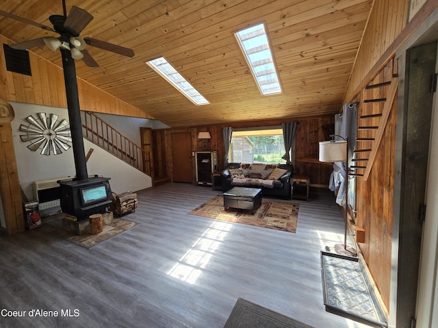 475 Old Range Rd, Clark Fork, ID 83811 - living room with a wood stove, stairs, lofted ceiling, wood ceiling, and a ceiling fan