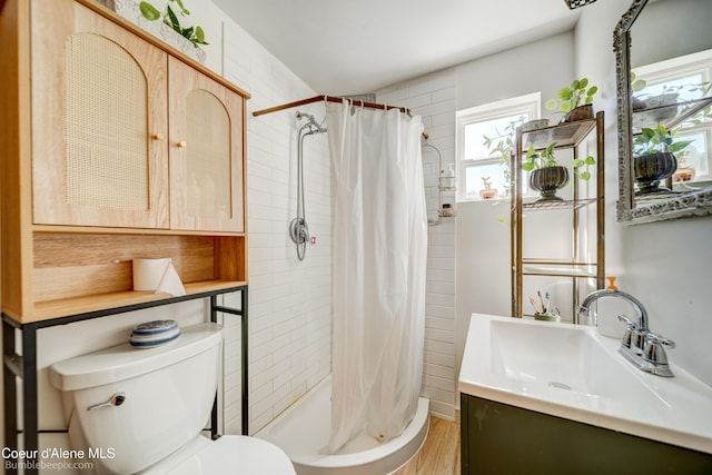 219 E 4th St, Oldtown, ID 83822 - bathroom featuring vanity, a stall shower, and wood finished floors