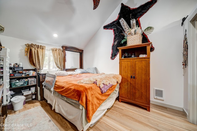 219 E 4th St, Oldtown, ID 83822 - bedroom featuring vaulted ceiling and light wood-style flooring