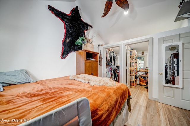 219 E 4th St, Oldtown, ID 83822 - bedroom featuring light wood-style floors, a closet, lofted ceiling, a ceiling fan, and a walk in closet