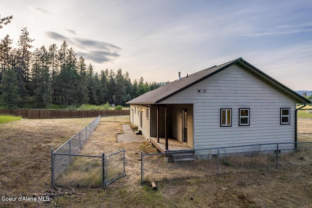 156 Promise Ln, Moyie Springs, ID 83845 - rear view of house featuring a fenced backyard and a gate