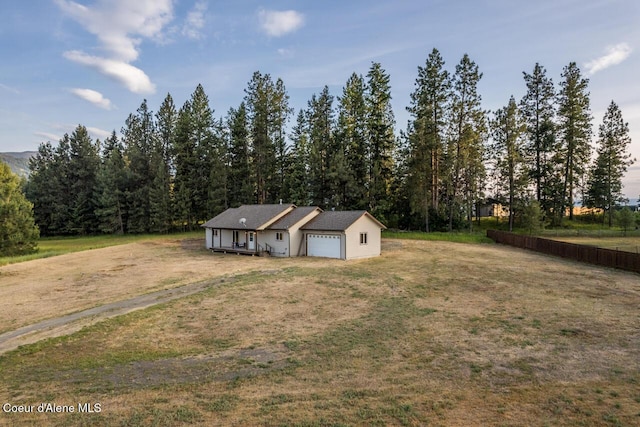 156 Promise Ln, Moyie Springs, ID 83845 - view of front of property with an attached garage, a front lawn, and driveway
