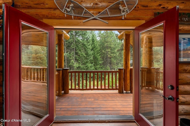26443 S Farup Rd, Worley, ID 83876 - doorway featuring a forest view and log walls