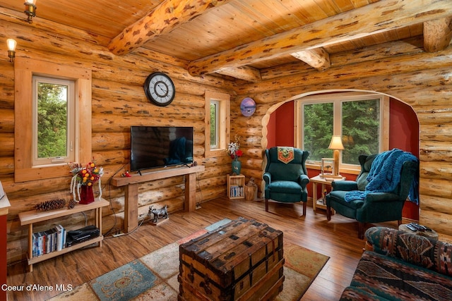 26443 S Farup Rd, Worley, ID 83876 - living room featuring a wooden ceiling with exposed beams, wood-type flooring, plenty of natural light, arched walkways, and log walls