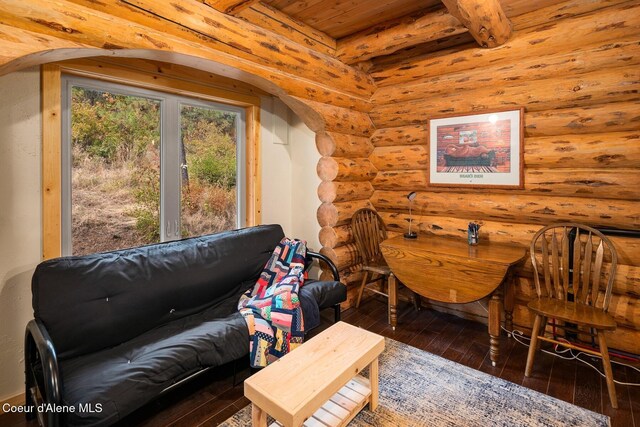 26443 S Farup Rd, Worley, ID 83876 - sitting room with rustic walls, arched walkways, hardwood / wood-style floors, and a wood ceiling with exposed beams
