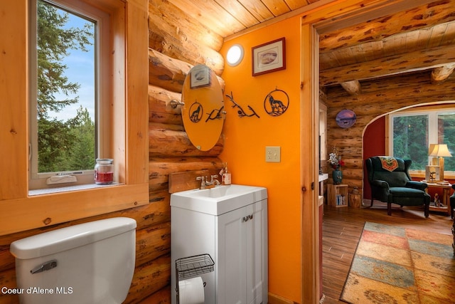 26443 S Farup Rd, Worley, ID 83876 - bathroom featuring rustic walls, a wood ceiling with exposed beams, wood finished floors, plenty of natural light, and vanity