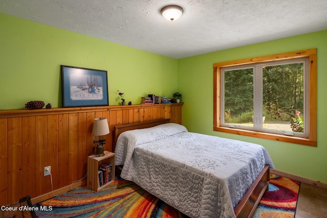 26443 S Farup Rd, Worley, ID 83876 - carpeted bedroom featuring a textured ceiling and baseboards