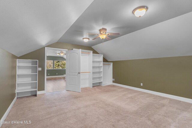 822 Ridgewood, Kamiah, ID 83536 - additional living space with light carpet, a ceiling fan, and vaulted ceiling