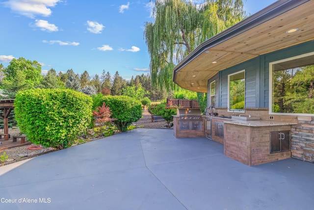 822 Ridgewood, Kamiah, ID 83536 - view of patio featuring exterior kitchen
