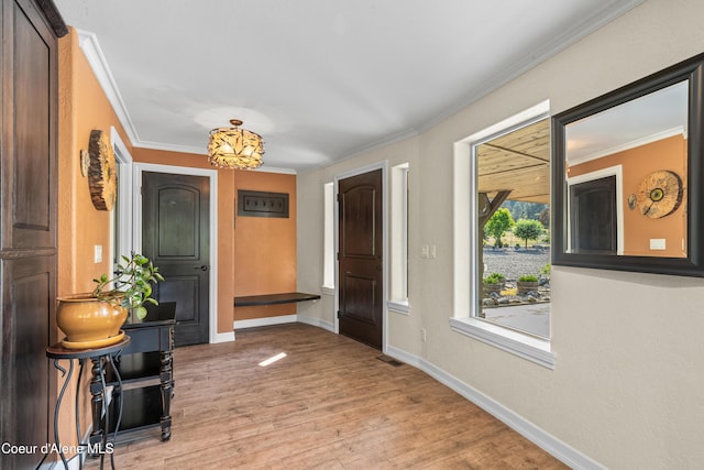 822 Ridgewood, Kamiah, ID 83536 - foyer with crown molding and light wood-style flooring