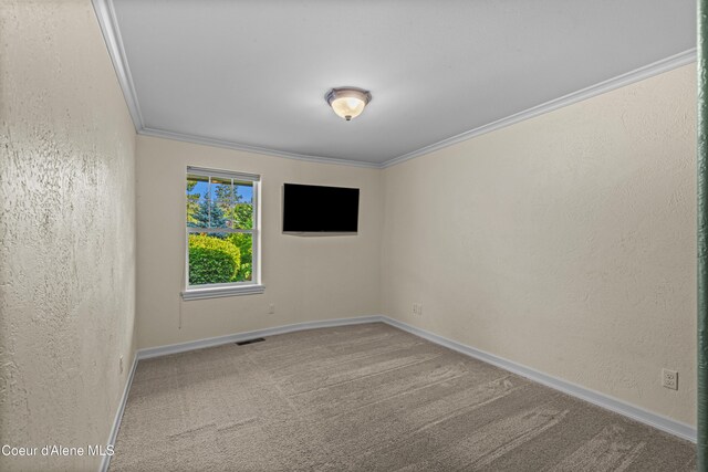 822 Ridgewood, Kamiah, ID 83536 - spare room featuring crown molding, carpet floors, and a textured wall