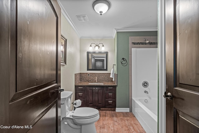 822 Ridgewood, Kamiah, ID 83536 - bathroom with ornamental molding, wood finished floors, vanity, and  shower combination