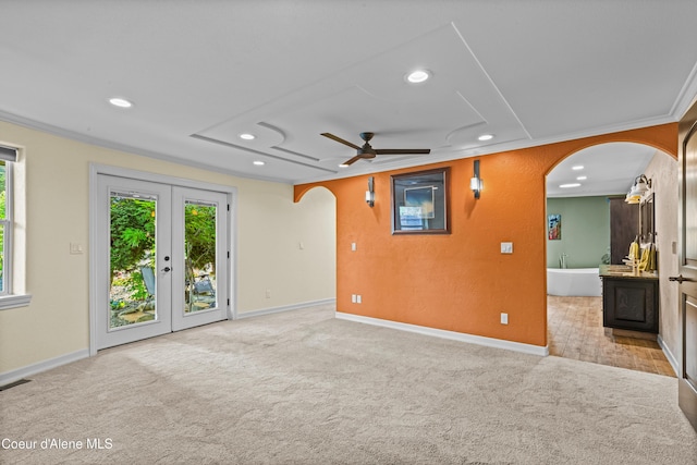 822 Ridgewood, Kamiah, ID 83536 - carpeted empty room featuring arched walkways, plenty of natural light, recessed lighting, a ceiling fan, and crown molding