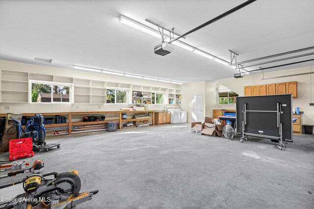 822 Ridgewood, Kamiah, ID 83536 - garage featuring a garage door opener and washer and dryer