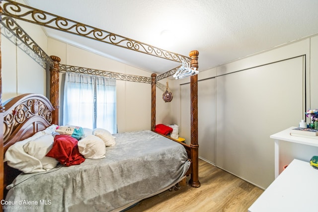 221 E 4th St, Oldtown, ID 83822 - bedroom with lofted ceiling and wood finished floors