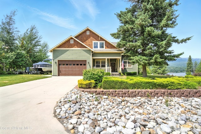 30 Beacon Hill Rd, Cocolalla, ID 83813 - craftsman-style home with covered porch, concrete driveway, an attached garage, and a front yard