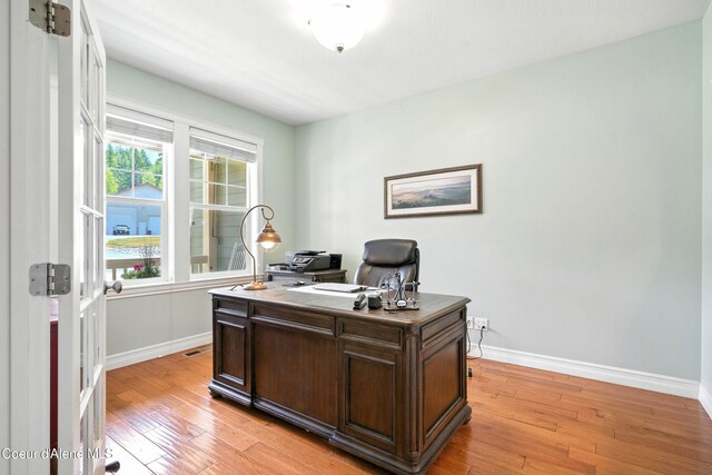 30 Beacon Hill Rd, Cocolalla, ID 83813 - home office with baseboards and light wood-style floors