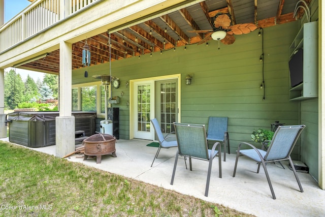 30 Beacon Hill Rd, Cocolalla, ID 83813 - view of patio featuring a hot tub, a ceiling fan, and an outdoor fire pit