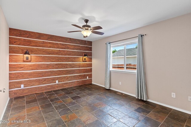 14106 N Lauren Loop, Rathdrum, ID 83858 - spare room with ceiling fan and dark stone finish flooring