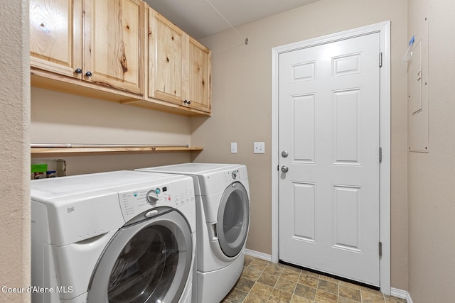 14106 N Lauren Loop, Rathdrum, ID 83858 - laundry room with washer and clothes dryer, cabinet space, and stone finish floors