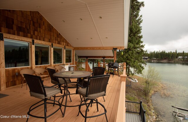 1349 Lakeshore Dr, Libby, MT 59923 - wooden terrace featuring area for grilling, a water view, and outdoor dining space