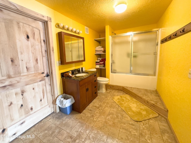 1349 Lakeshore Dr, Libby, MT 59923 - full bathroom featuring vanity, a textured ceiling, and enclosed tub / shower combo