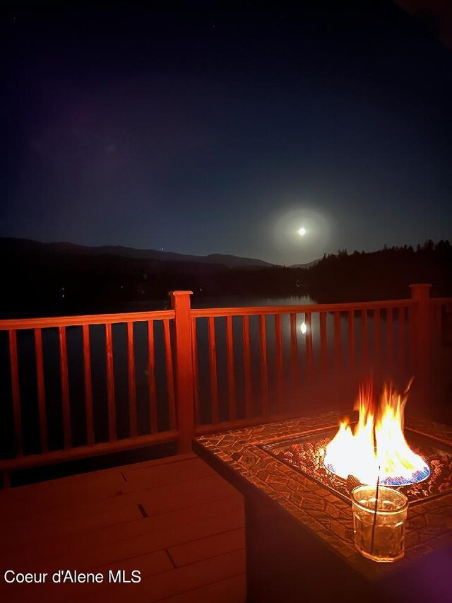 1349 Lakeshore Dr, Libby, MT 59923 - deck at twilight with a fire pit