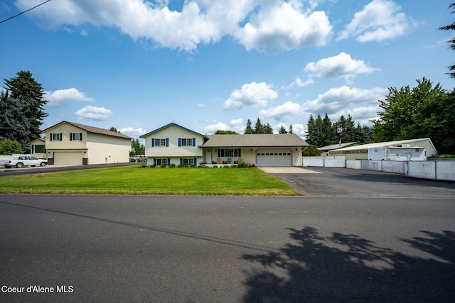 9270 N Maple St, Hayden, ID 83835 - view of front of home with driveway and a garage