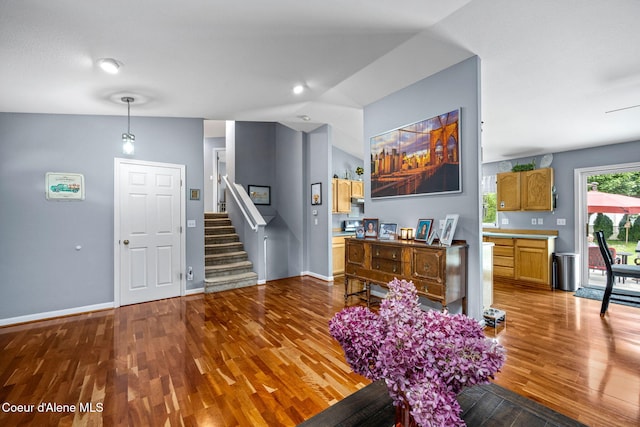 9270 N Maple St, Hayden, ID 83835 - living room featuring wood finished floors, stairs, and lofted ceiling