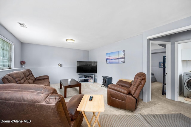 9270 N Maple St, Hayden, ID 83835 - living area featuring carpet flooring and washer / clothes dryer