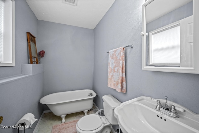 9270 N Maple St, Hayden, ID 83835 - bathroom featuring a freestanding bath and a sink