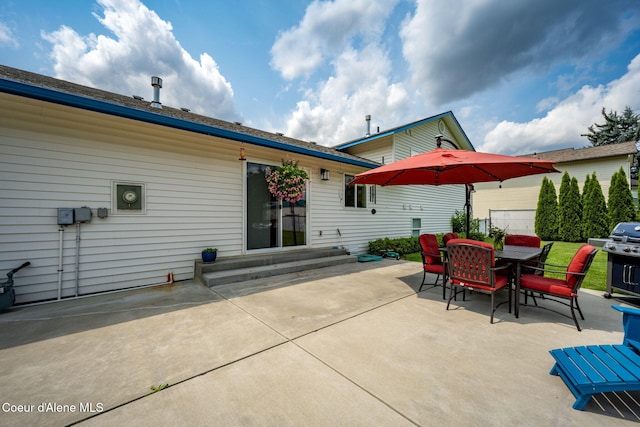 9270 N Maple St, Hayden, ID 83835 - rear view of property with a patio, outdoor dining area, and entry steps