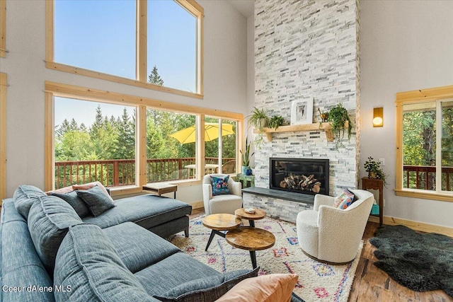 6101 Bottle Bay Rd, Sagle, ID 83860 - living area with a towering ceiling, wood finished floors, and a fireplace
