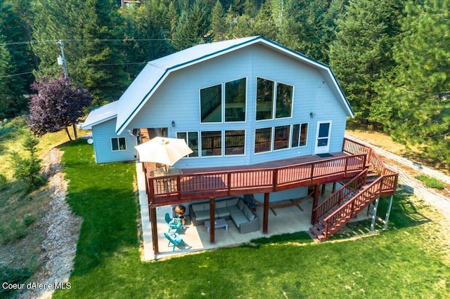 6101 Bottle Bay Rd, Sagle, ID 83860 - rear view of property with a patio, a deck, and a gambrel roof
