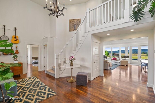 6744 E Greta Ave, Post Falls, ID 83854 - foyer featuring stairs, wood finished floors, a chandelier, a towering ceiling, and recessed lighting