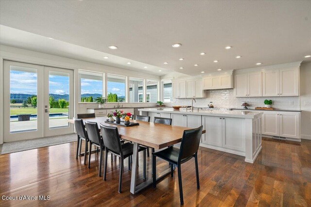 6744 E Greta Ave, Post Falls, ID 83854 - dining room featuring recessed lighting, dark wood-style flooring, and french doors