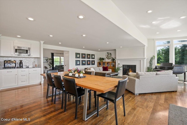 6744 E Greta Ave, Post Falls, ID 83854 - dining space featuring recessed lighting, wood finished floors, and a fireplace
