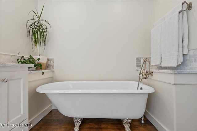 6744 E Greta Ave, Post Falls, ID 83854 - full bathroom featuring a soaking tub and wood finished floors