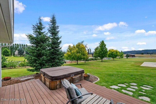 6744 E Greta Ave, Post Falls, ID 83854 - deck featuring a hot tub and a lawn